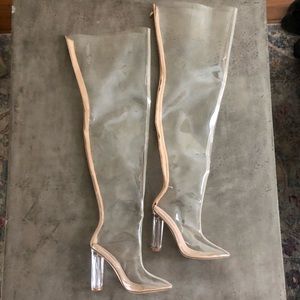 Thigh high clear boots